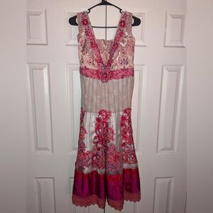 No brand, formal dress with beaded sequins and lace. Has breast pads sewn in.